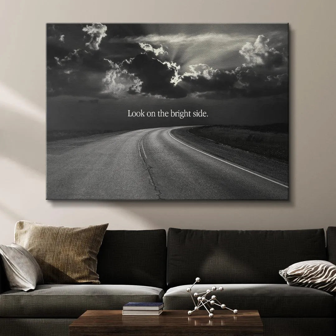 Wide-angle shot of the deserted highway leading toward the light, captioned Look On The Bright Side.