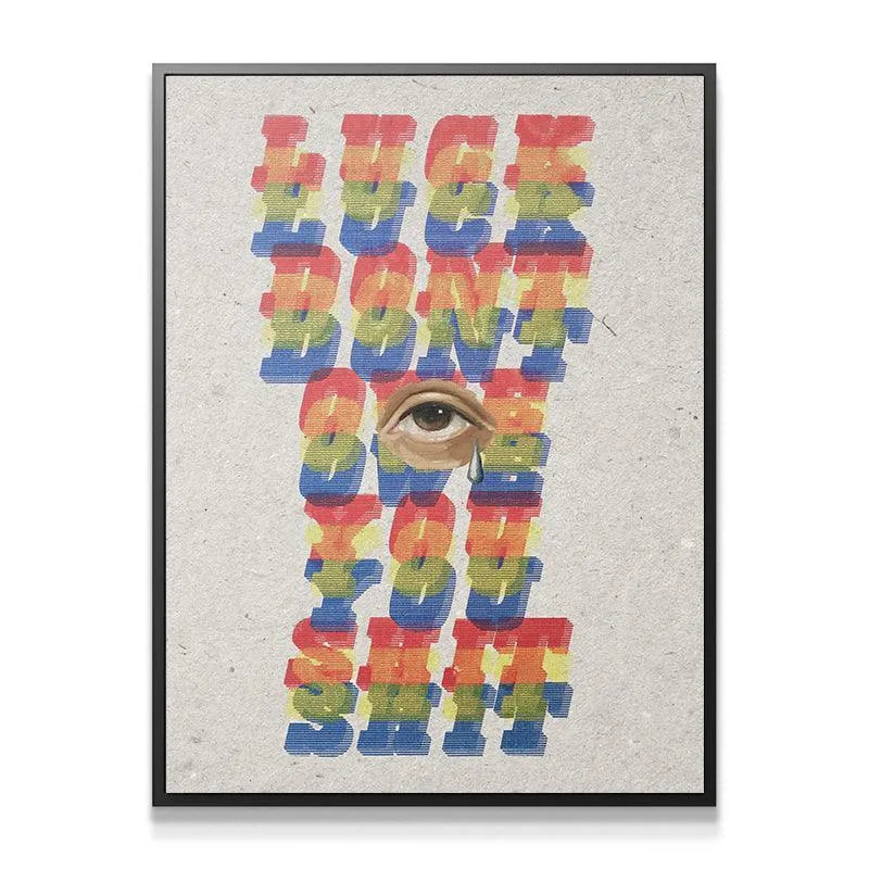 Extreme close-up of the realistic weeping eye centered within the distressed text 'Luck Don't Owe You Shit'.
