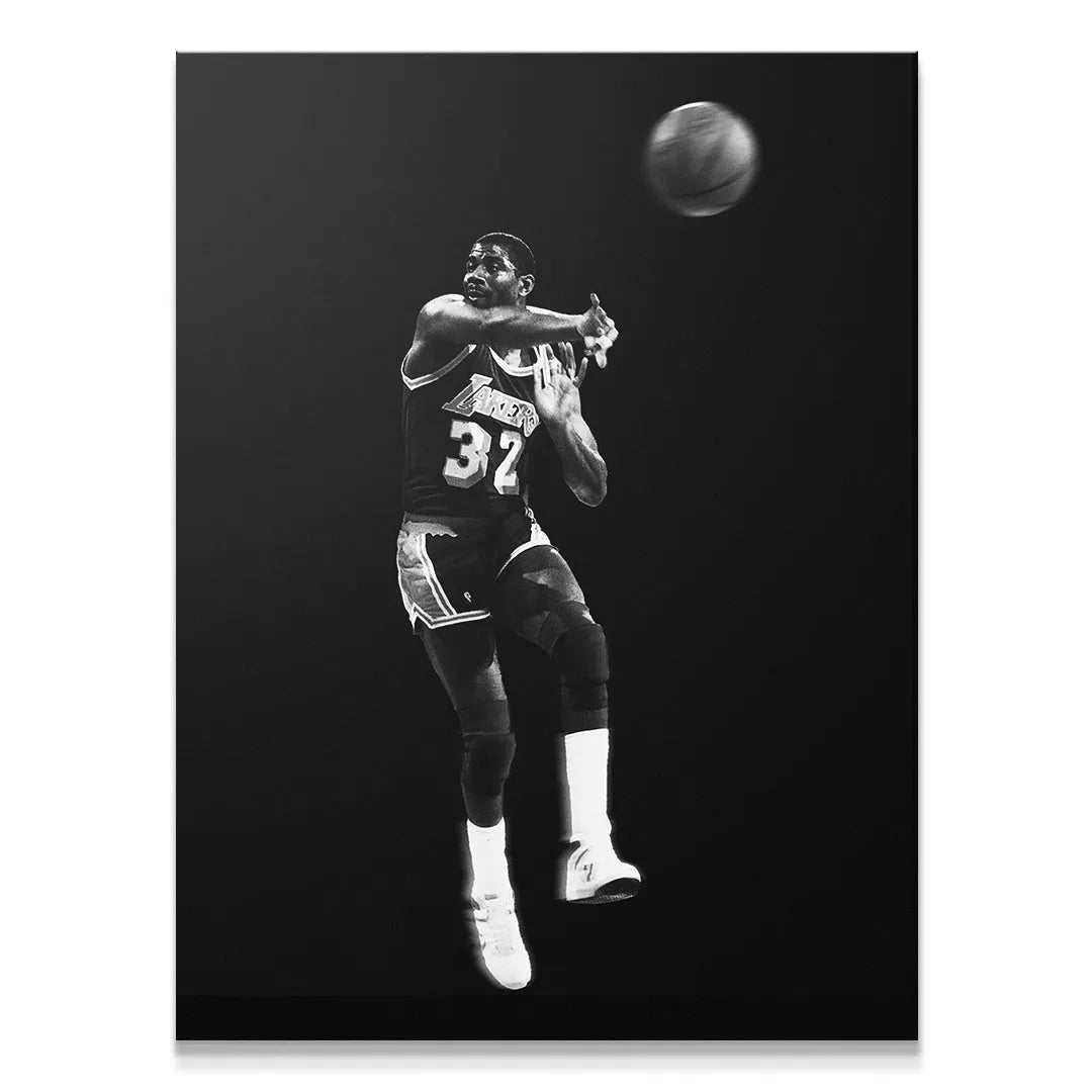 Full black background portrait of Magic Johnson - Made You Look during a fast break for the Los Angeles Lakers.