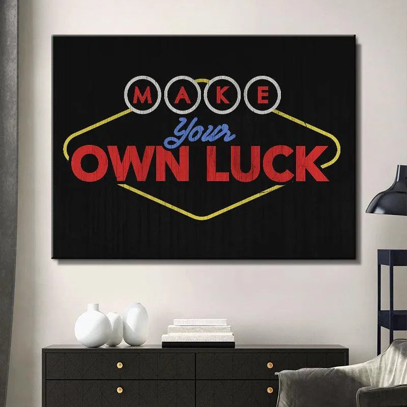 Detailed crop focusing solely on the letter circles in "M A K E" from the Make Your Own Luck sign graphic.