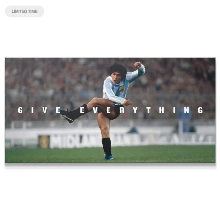 Maradona - Give Everything panoramic canvas print showcasing Diego executing a powerful high kick on the field.