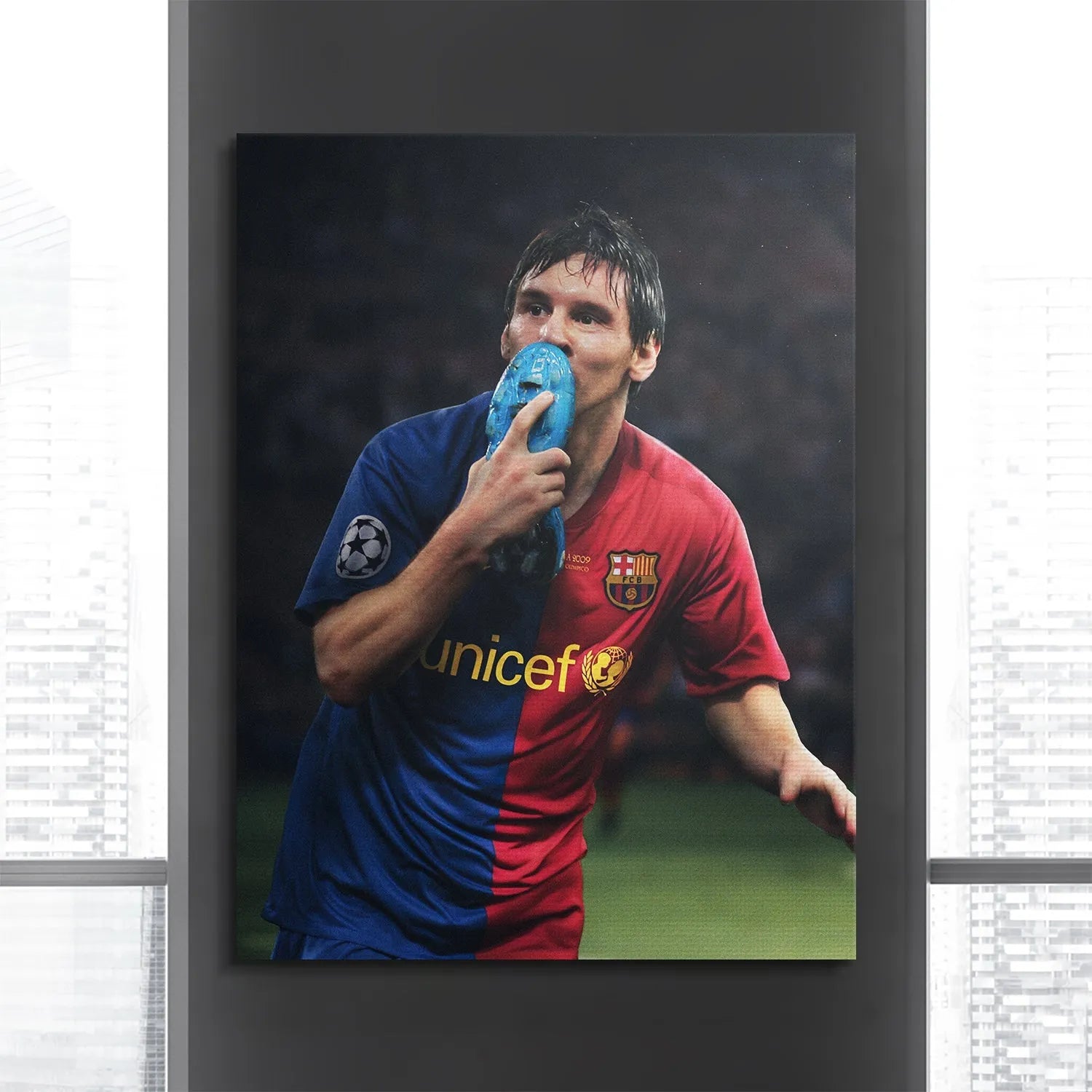 Stadium atmosphere captured behind the triumphant celebratory image, focusing on the Messi - Boot Kiss artwork.