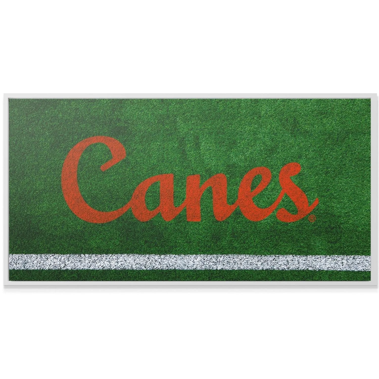 Low-angle perspective of the vibrant orange 'Canes' script embedded in the Miami - Field Logo.
