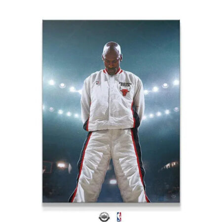 Full body shot of Michael Jordan - Encore standing solemnly in white Bulls warm-up suit.