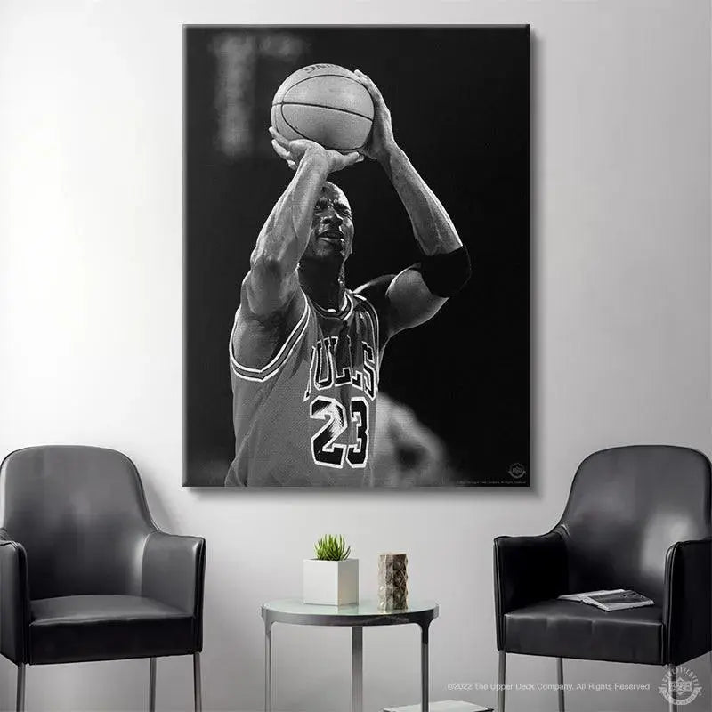 Lifestyle shot featuring the framed wall art Michael Jordan - Eyes Closed displayed in a sports memorabilia room.