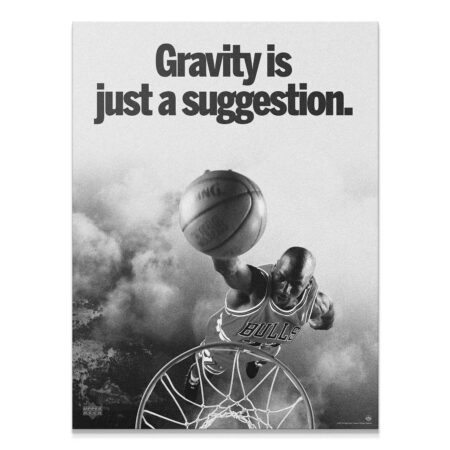 High-contrast close-up of Michael Jordan dunking above the rim showcasing the quote: Gravity Is Just A Suggestion.