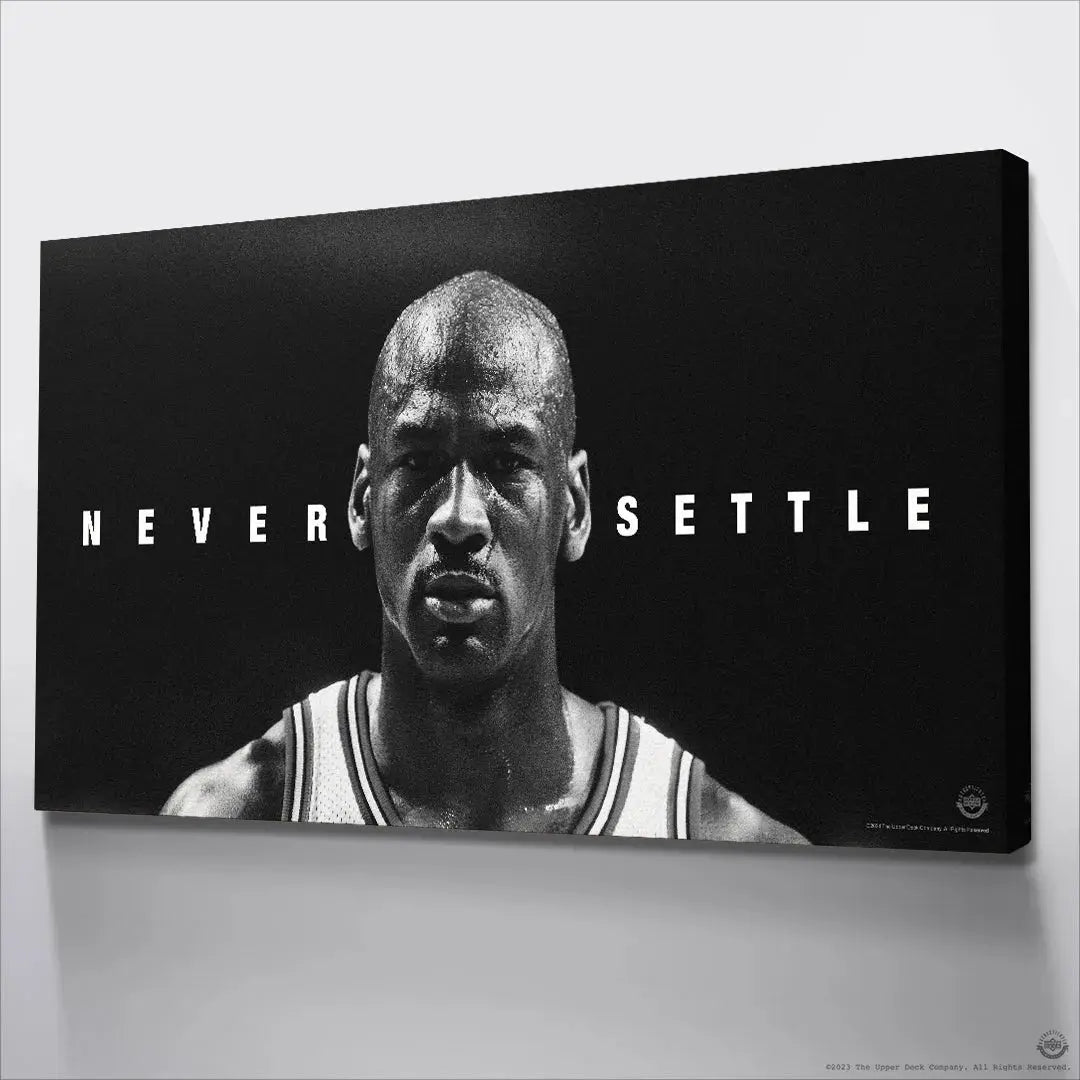 High-contrast lighting defining the facial features in the iconic Michael Jordan - Never Settle photograph.