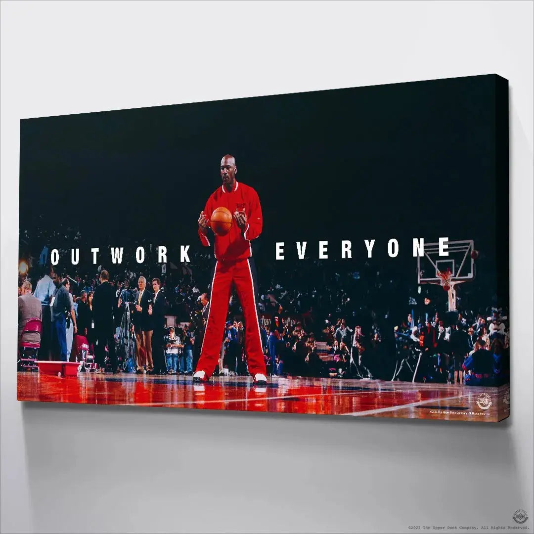 High-contrast lighting highlighting MJ's vibrant red tracksuit in the determined Michael Jordan - Outwork Everyone image.