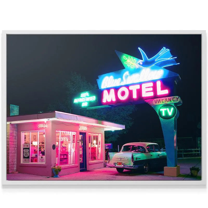 Low-angle perspective photograph of the motel office building and the dramatic overhead sign advertising Refrigerated Air.