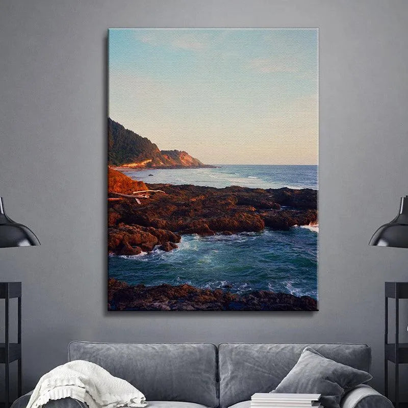 Lifestyle setting: 'Seaside' wall art displayed prominently above a modern living room sofa.