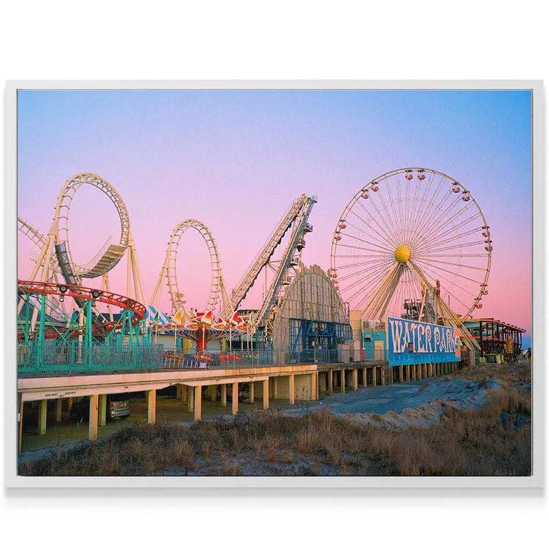 Atmospheric view of the Ferris wheel silhouette during Summers Down the Shore, highlighting the bright yellow center hub.