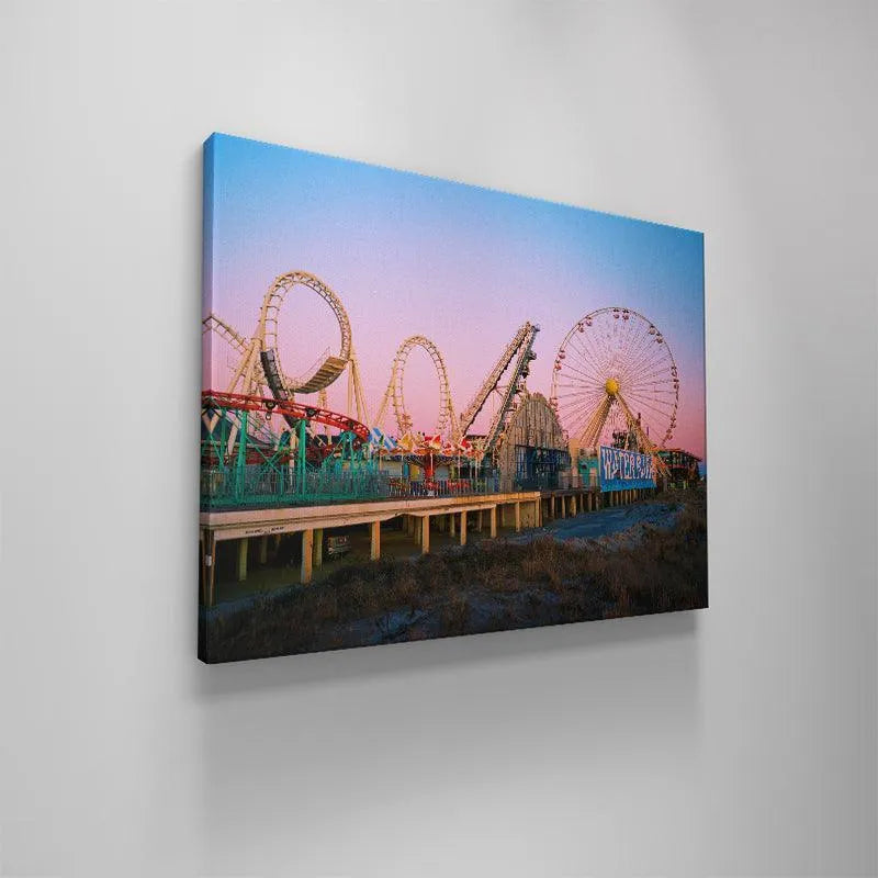 The dramatic pink and blue color gradient of the dawn or dusk sky in the Summers Down the Shore photograph.
