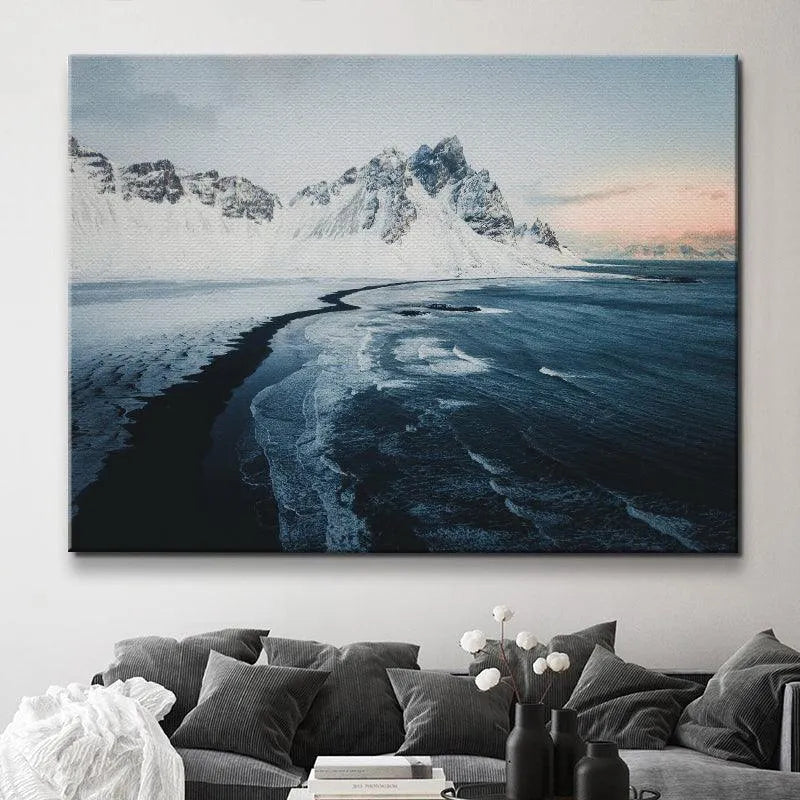 Mid-ground perspective showing the snow line extending down the Vestrahorn slopes at Sunrise at stokksnes.
