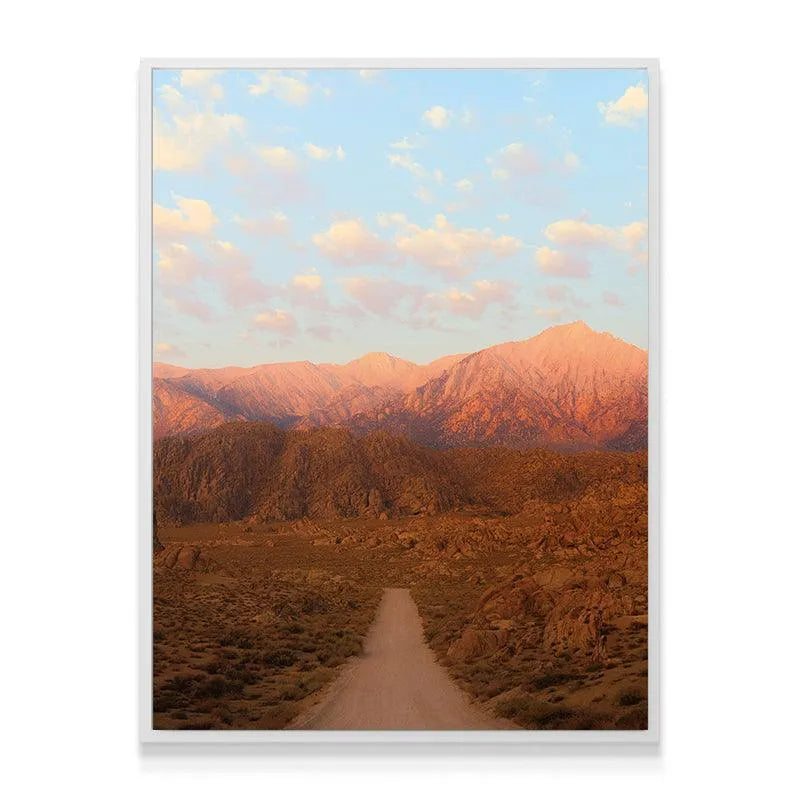 Wide landscape view emphasizing the pink and orange alpenglow on the mountains in 'Sunrise In the Sierras'.