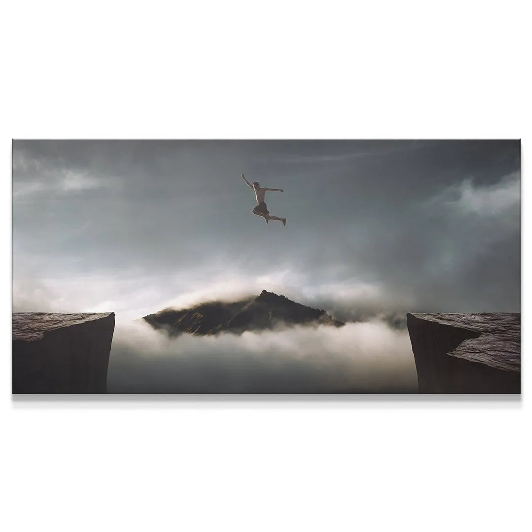 Wide panoramic view of the man jumping between dark cliffs, titled 'Take The Risk (Jump No Quote)'.