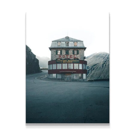 Wide shot of The Belvedere hotel exterior nestled between rugged mountains.