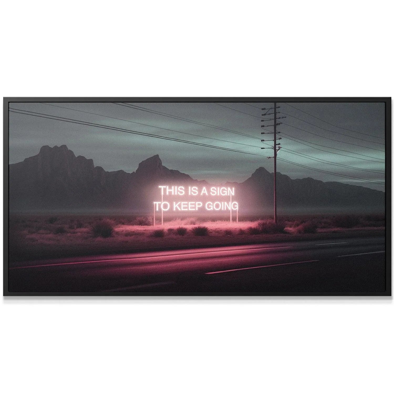 Wide landscape view featuring 'This Is A Sign' artwork with dark mountains in the distance.