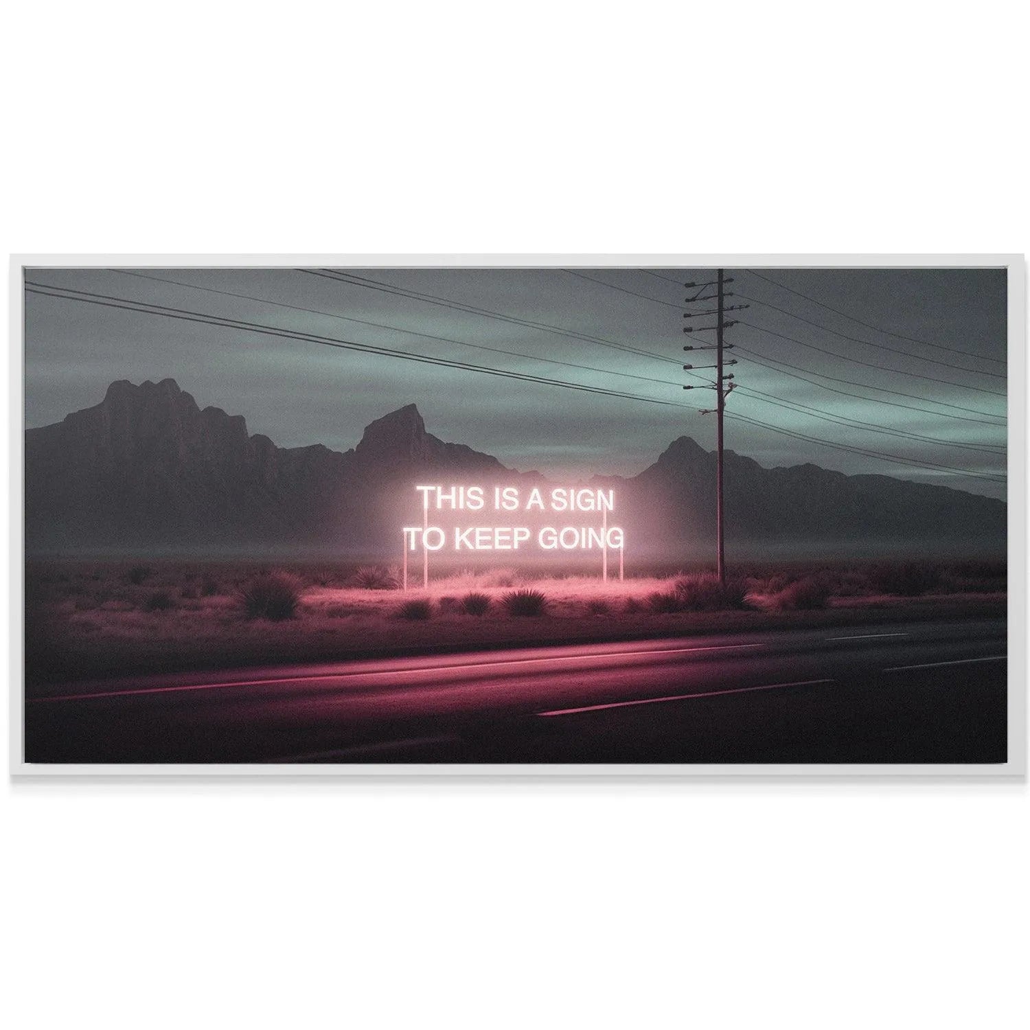 Angle shot of the road reflecting the vibrant magenta light emanating from 'This Is A Sign' signpost.