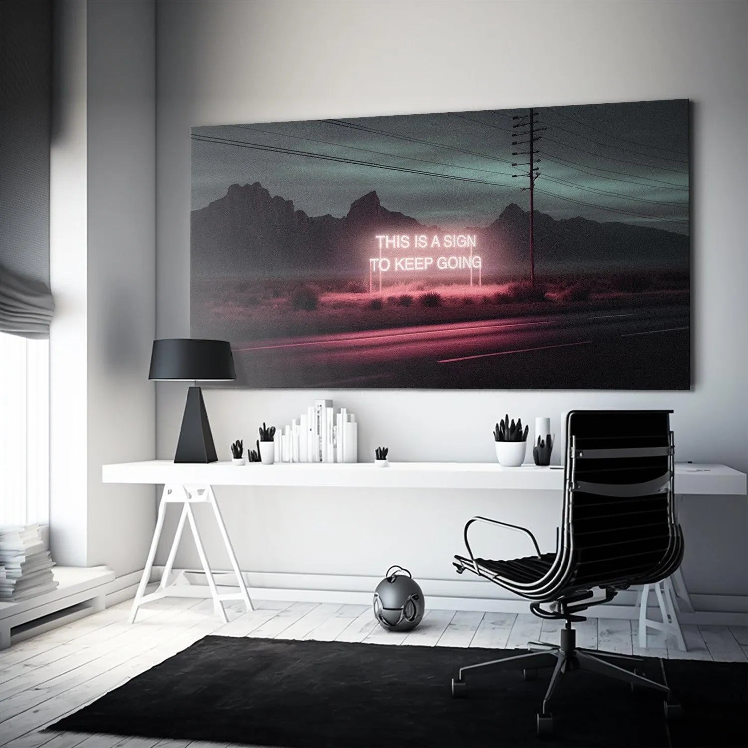 Lifestyle image: 'This Is A Sign' motivational print hanging above a minimalist office desk.