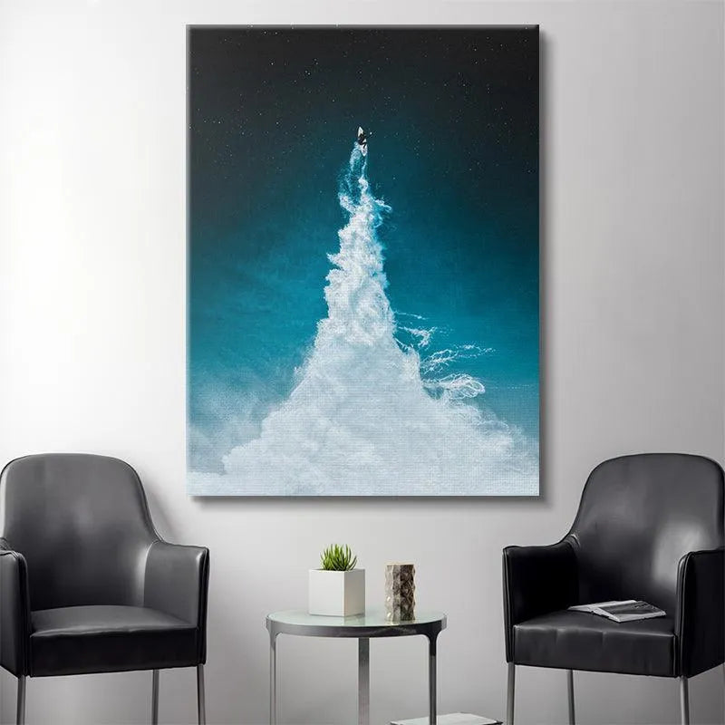 Detailed view of the small surfer figure scaling the massive wave in the 'To The Moon' image.