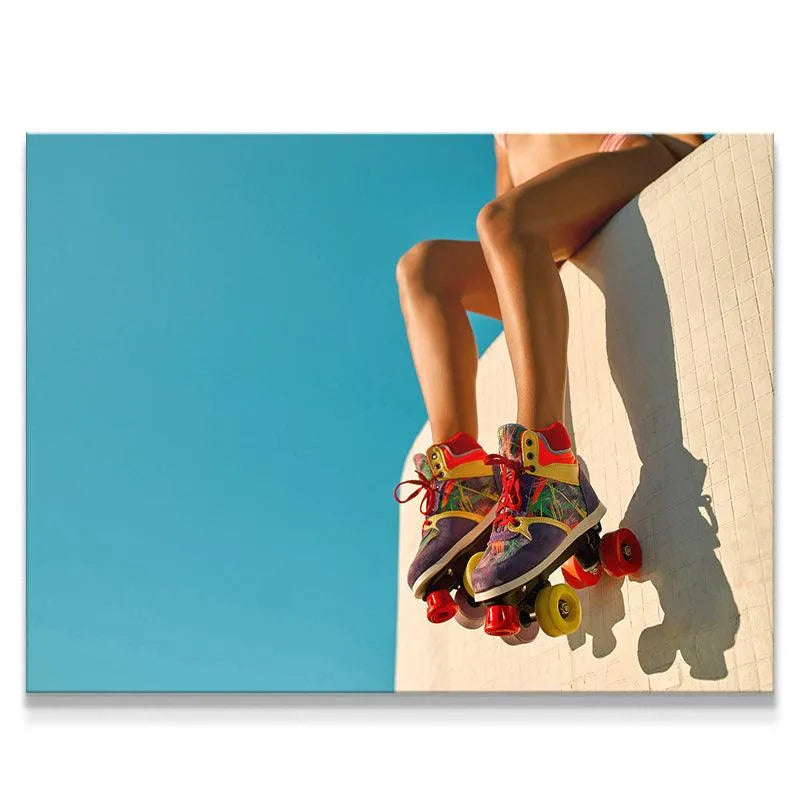 Close-up view of colorful roller skates worn by a woman sitting down at Venice Boardwalk.